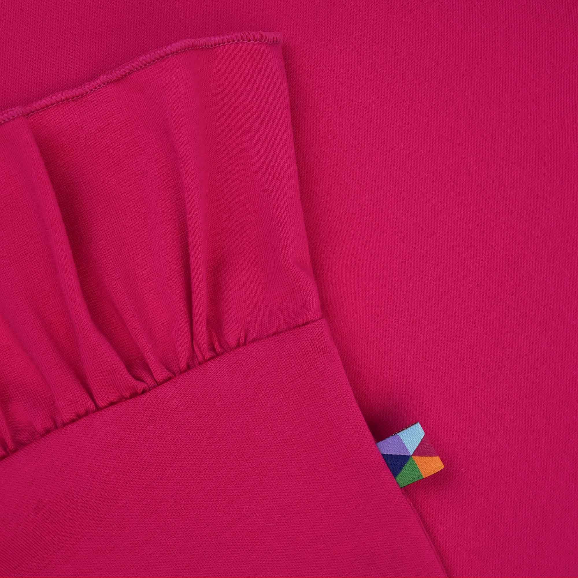 Różowa bluzka z falbanką z krótkim rękawem