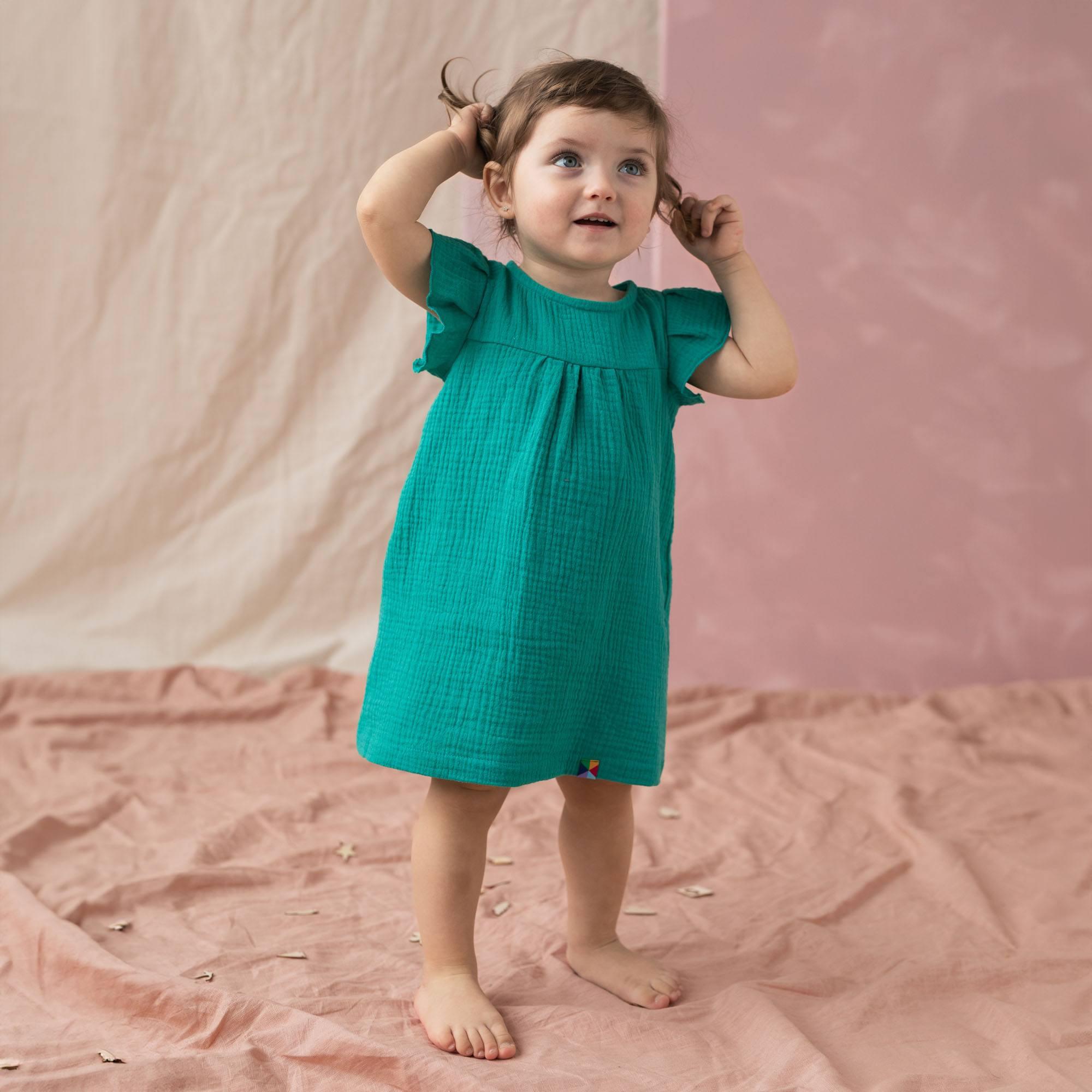 Turkusowa sukienka muślinowa niemowlęca