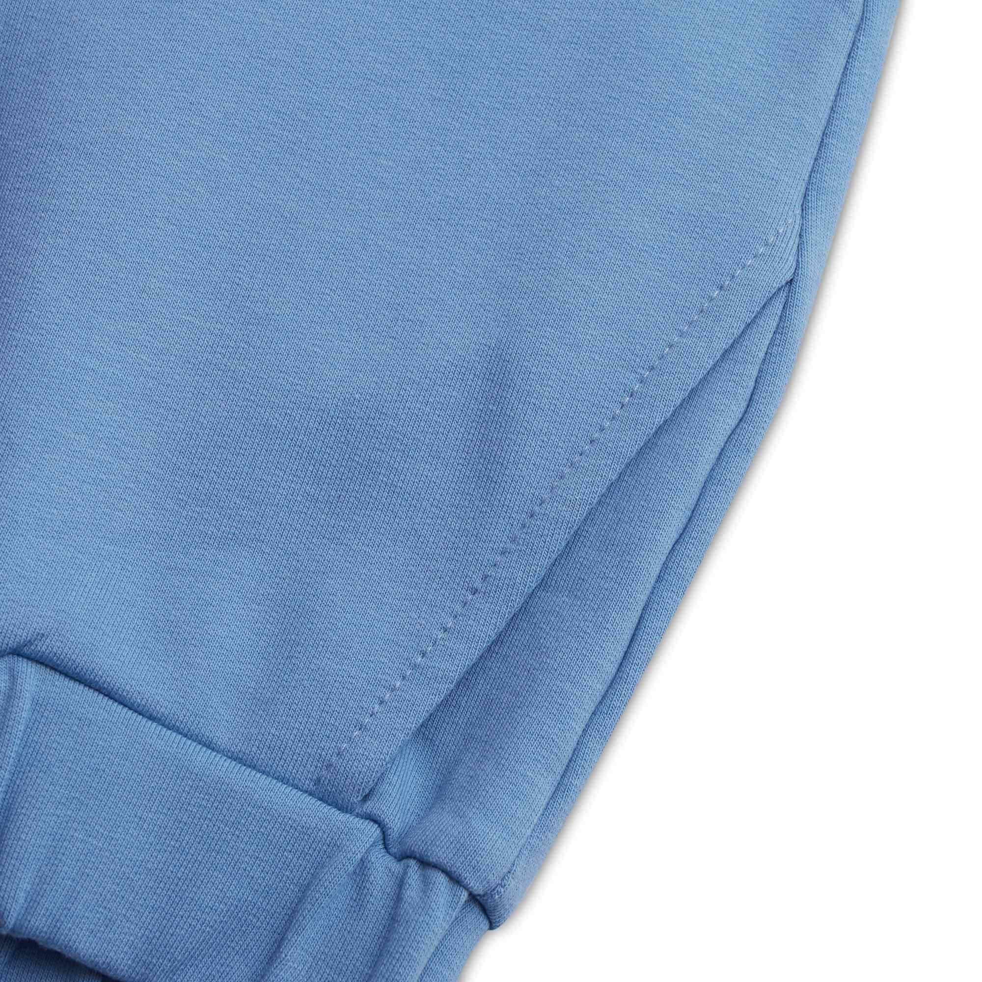Błękitne spodnie dresowe z kieszenią z tyłu
