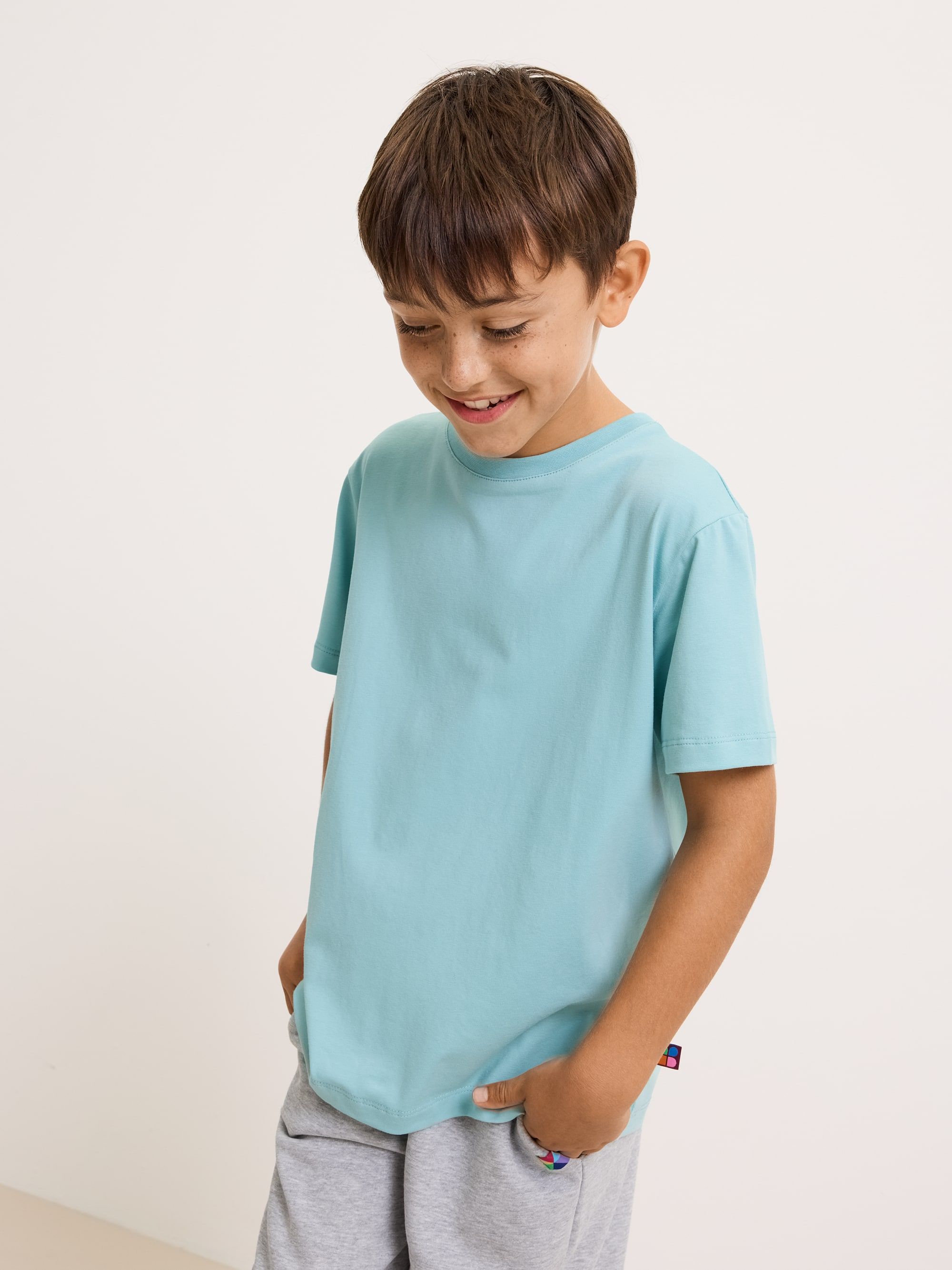 Jasnoturkusowy T-shirt ze ściągaczem Junior