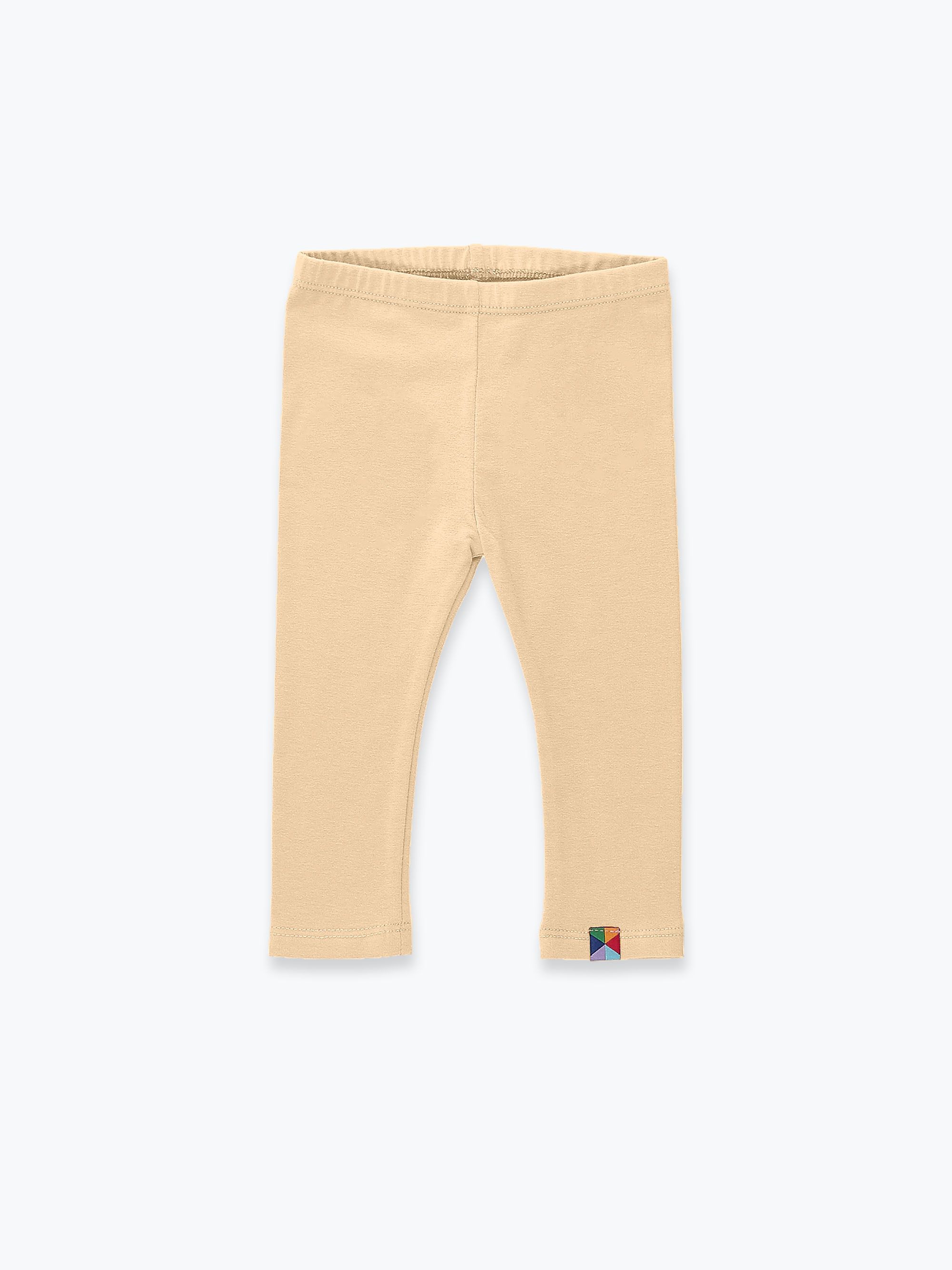 Beżowe legginsy
